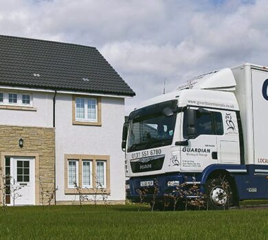 guardian removals truck outside of a house